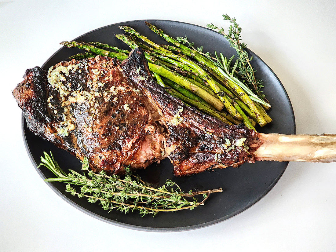 Image of fresh garlic and herb butter on grilled tomahawk steak